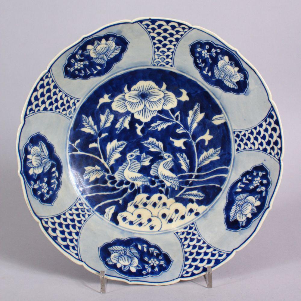 A CHINESE EXPORT BLUE & WHITE PORCELAIN PLATE -: A CHINESE EXPORT BLUE & WHITE PORCELAIN PLATE - decorated with birds and floral displays, 26cm high.