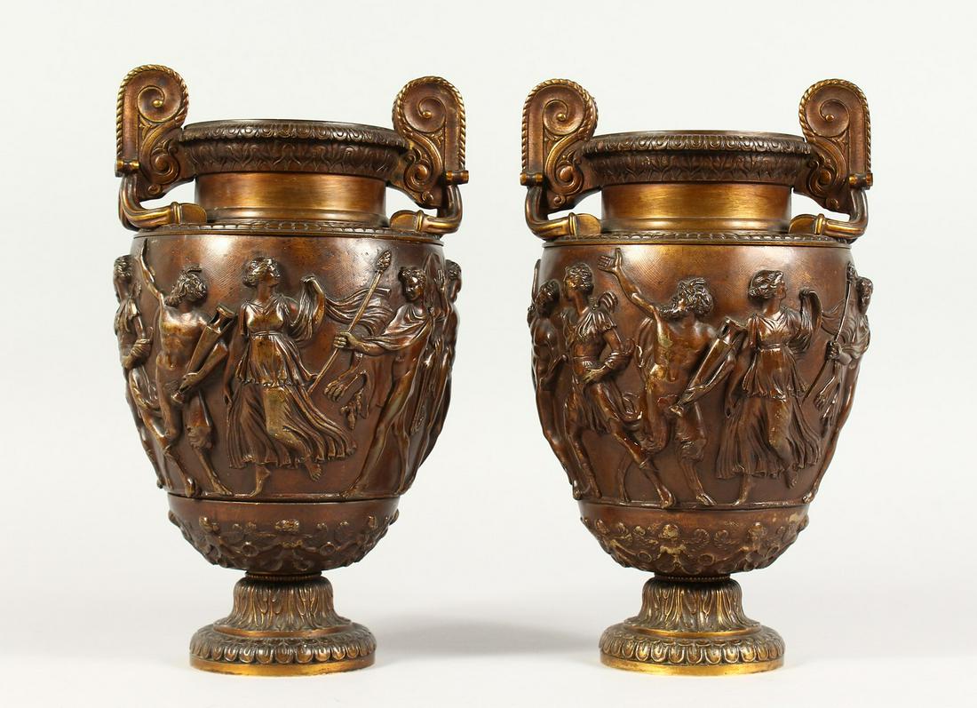 A PAIR OF SUPERB QUALITY 19TH CENTURY BRONZE: A PAIR OF SUPERB QUALITY 19TH CENTURY BRONZE RENAISSANCE DESIGN TWO-HANDLED URNS, the sides with Roman figures in relief. 10ins high.