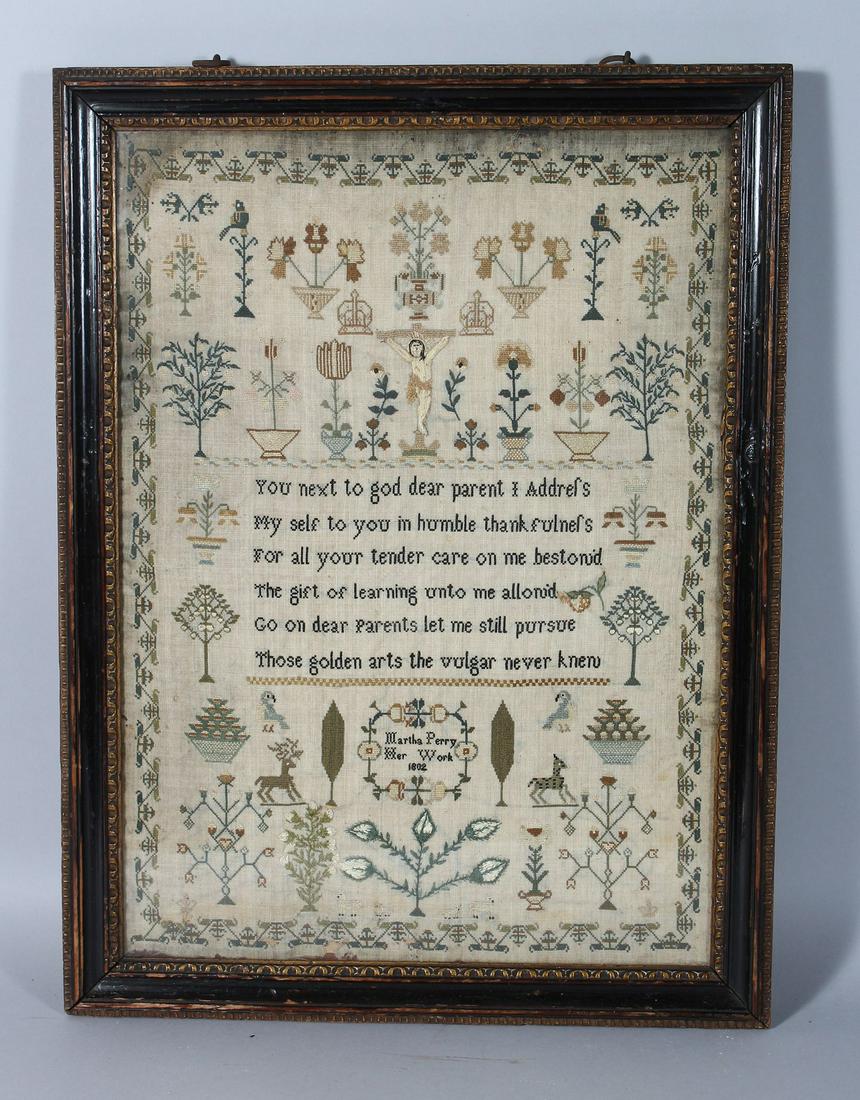 A GEORGE III FRAMED SAMPLER, "Martha Perry", her work: A GEORGE III FRAMED SAMPLER, "Martha Perry", her work 1802. 17ins x 12ins.