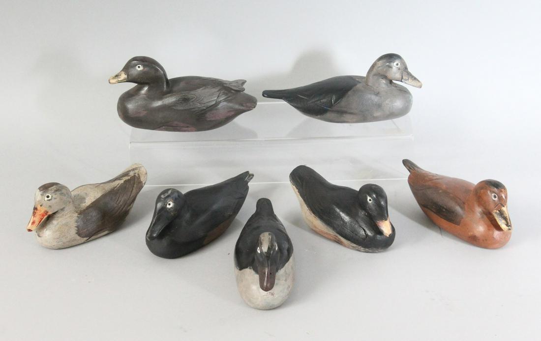 SEVEN PAINTED CARVED WOOD DECOY DUCKS.: SEVEN PAINTED CARVED WOOD DECOY DUCKS.