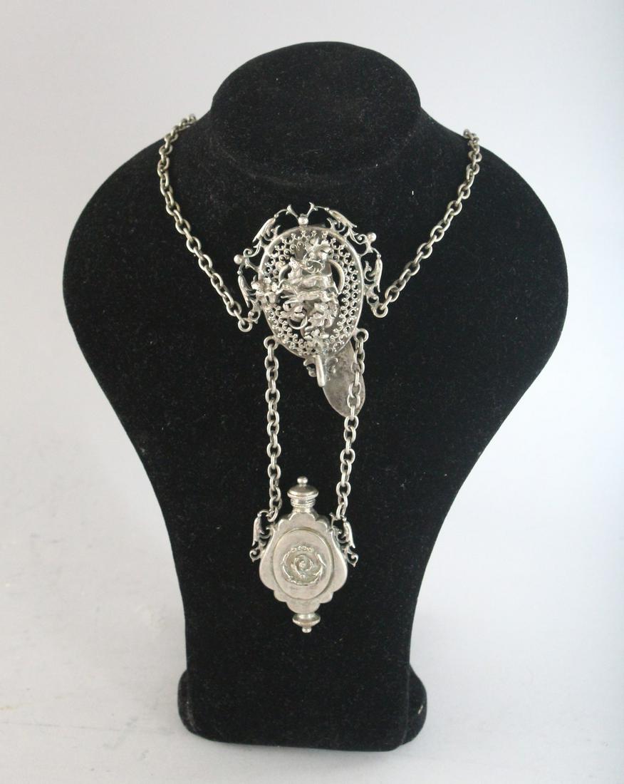 A SILVER CHATELAINE with a dog and deer medallion.: A SILVER CHATELAINE with a dog and deer medallion.