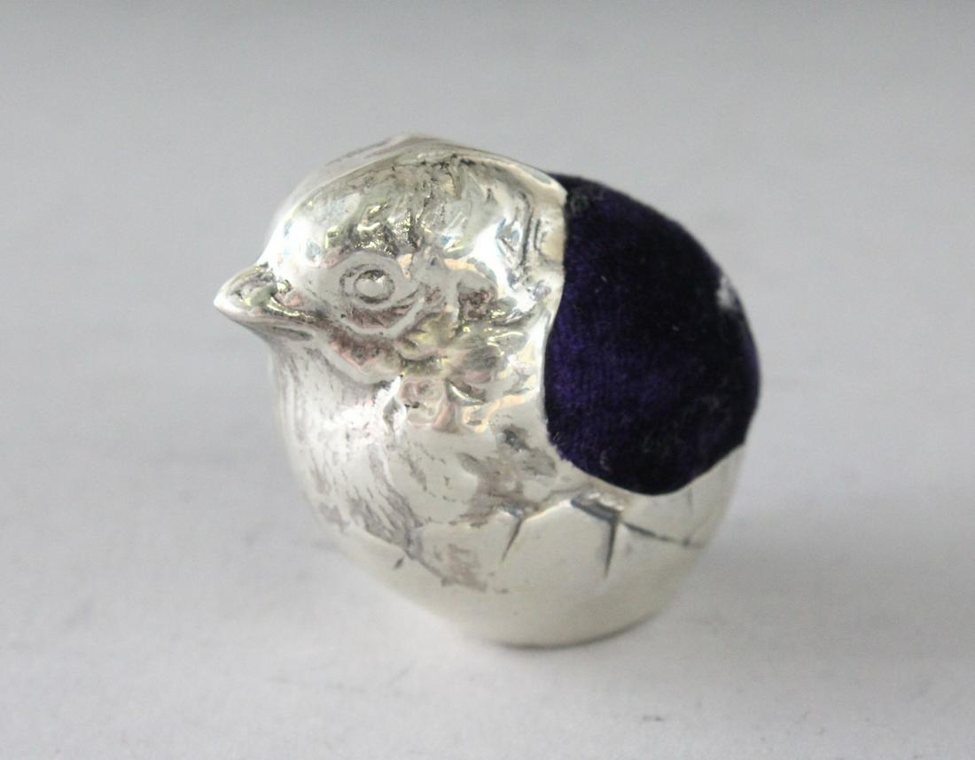 A SILVER CHICK PIN CUSHION. 2ins: A SILVER CHICK PIN CUSHION. 2ins