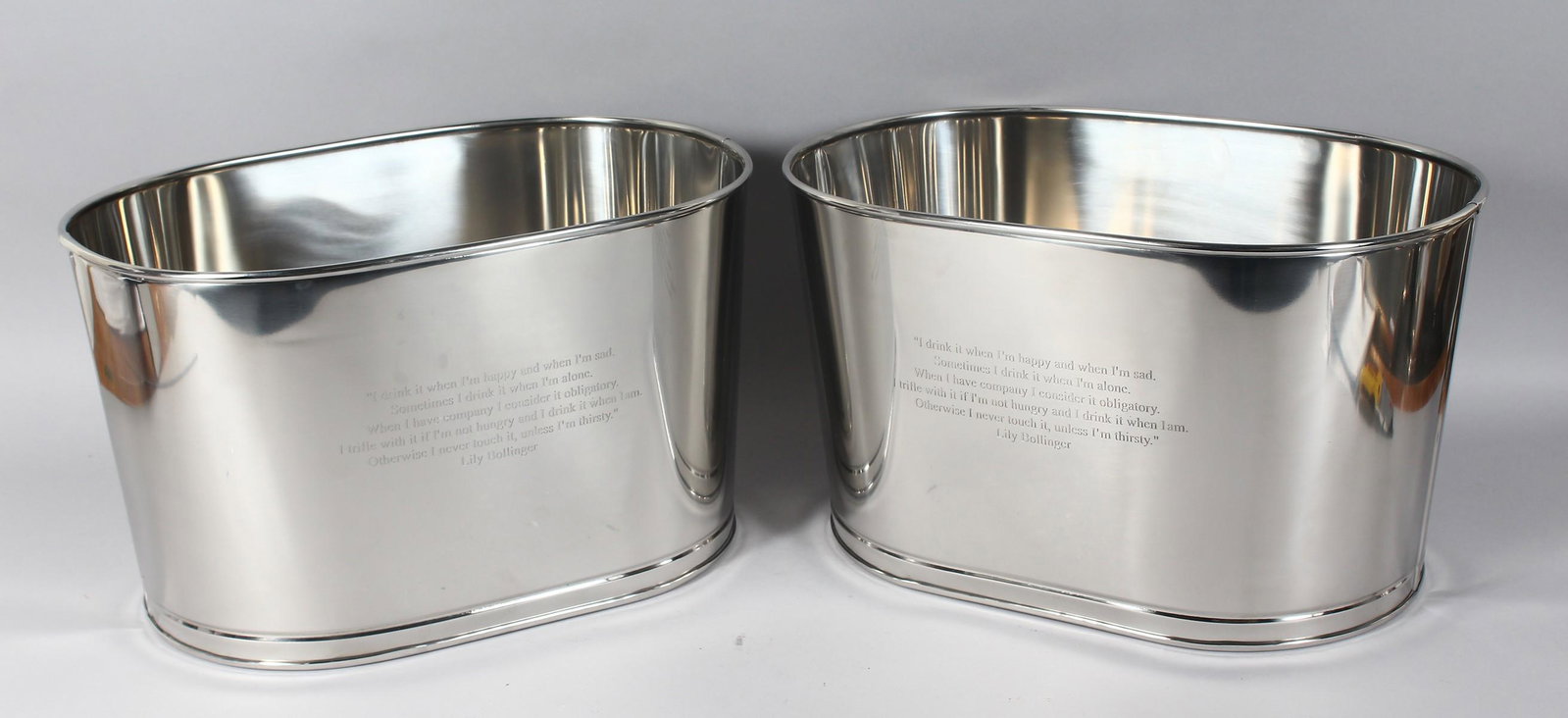 A MEDIUM PAIR OF BOLLINGER OVAL WINE COOLERS. 17ins: A MEDIUM PAIR OF BOLLINGER OVAL WINE COOLERS. 17ins long x 12ins high.
