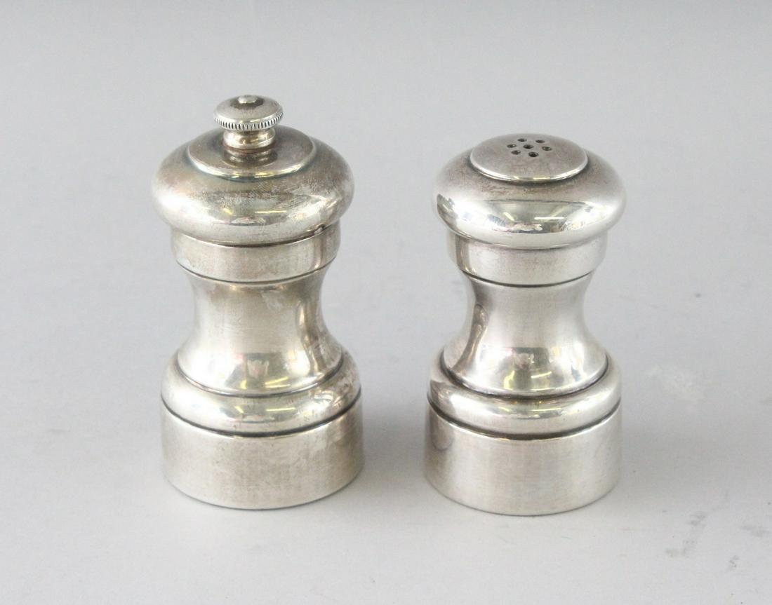A PAIR OF SILVER PEPPER MILLS.: A PAIR OF SILVER PEPPER MILLS.
