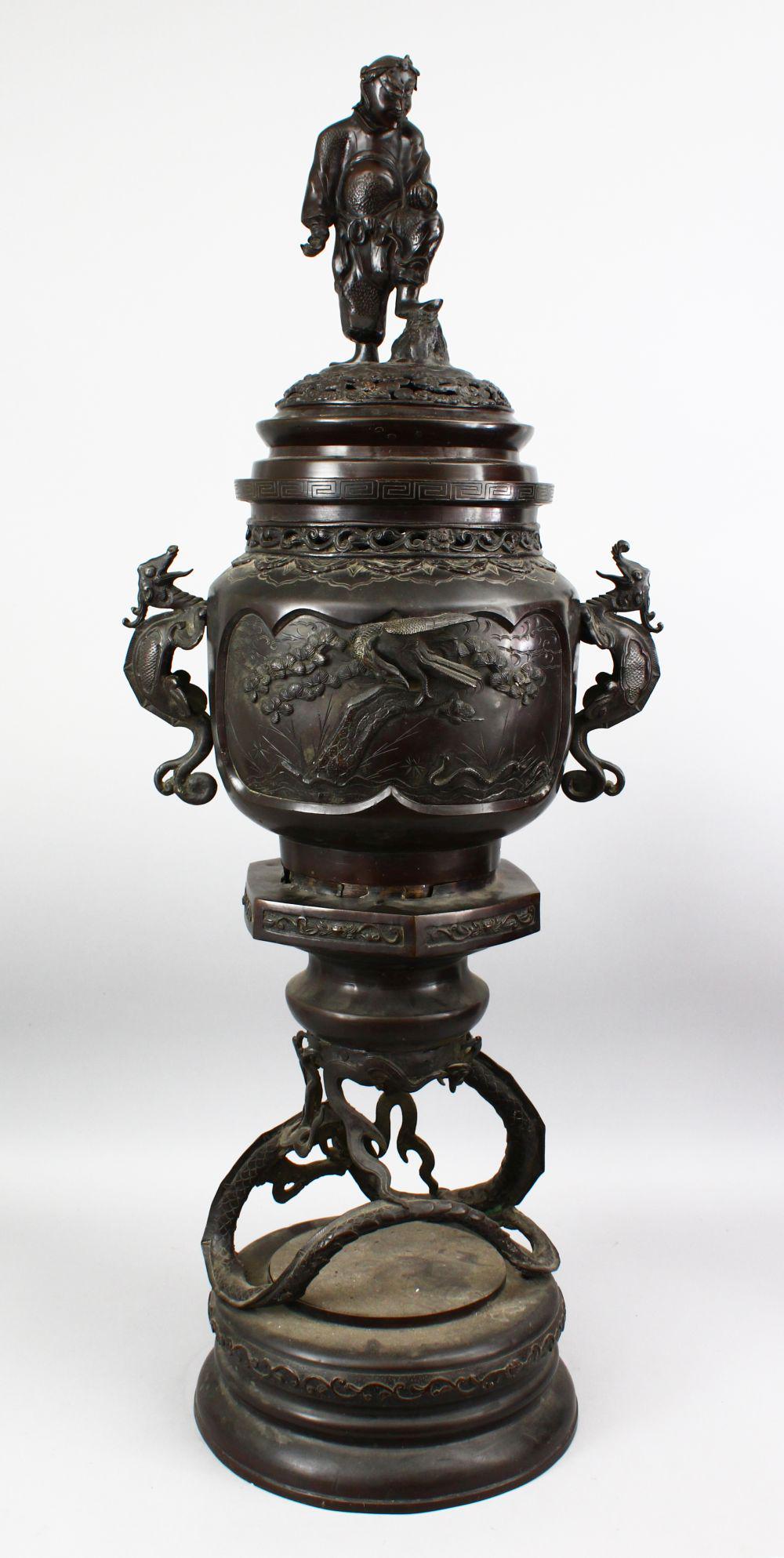 A LARGE JAPANESE MEIJI PERIOD THREE PIECE KORO, the: A LARGE JAPANESE MEIJI PERIOD THREE PIECE KORO, the koro with central section seated upon circular base suspended by a dragon, the central section with raised decoration of birds amongst flora, with t