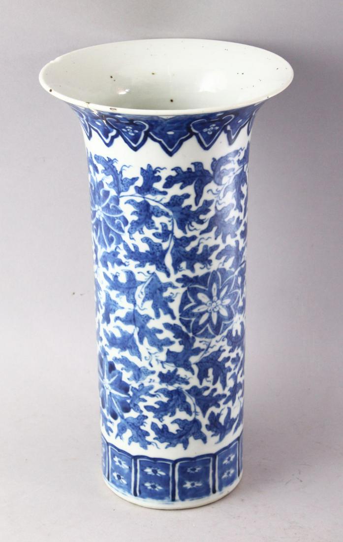 A 19TH CENTURY CHINESE BLUE AND WHITE PORCELAIN SLEEVE: A 19TH CENTURY CHINESE BLUE AND WHITE PORCELAIN SLEEVE VASE, with flared rim, floral decoration and a four character mark to base (AF), 30cm high.