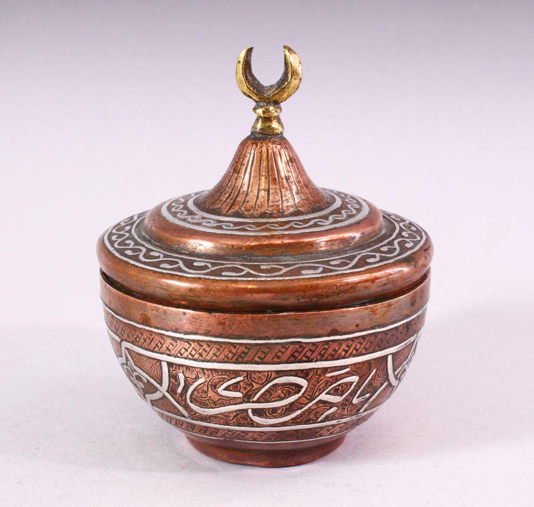 AN ISALMIC CIRCULAR COPPER AND SILVER INLAID BOX AND (1 of 6)