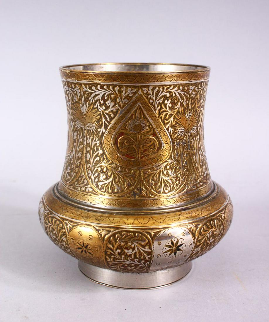 A SMALL INDIAN ENGRAVED BRASS AND WHITE METAL CIRCULAR (1 of 5)