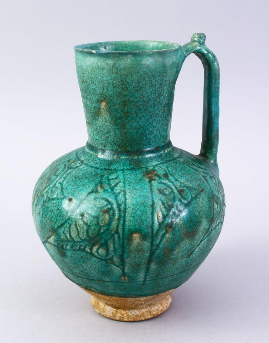 A GOOD EARLY ISLAMIC TURQUOISE GLAZED POTTERY JUG, 22cm (1 of 9)