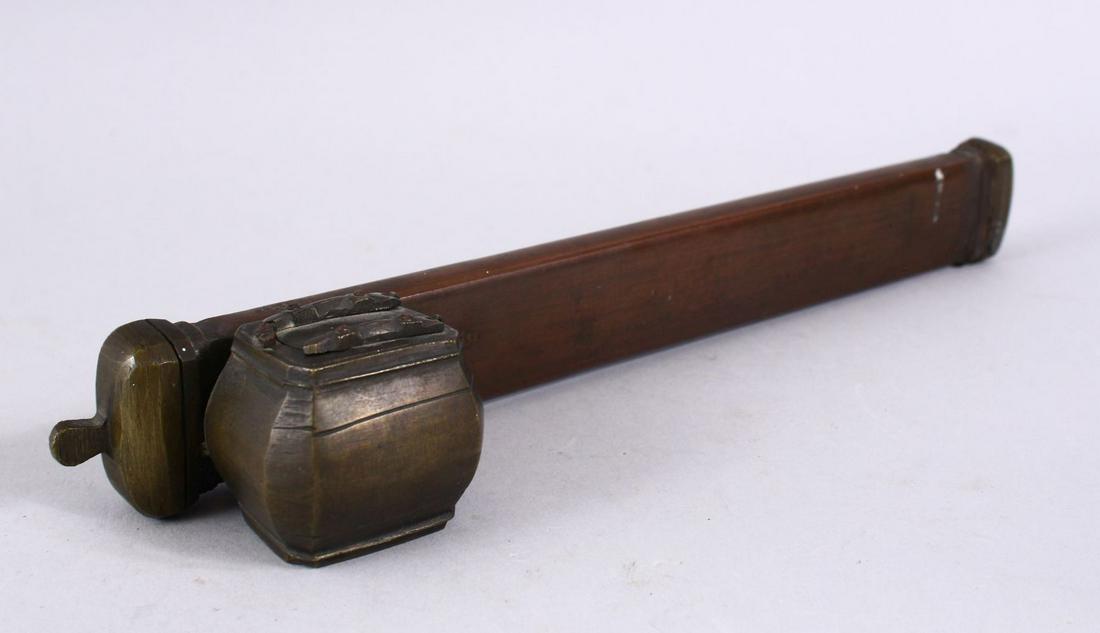 A GOOD ISLAMIC BRASS SIGNED INKWELL AND PEN HOLDER,: A GOOD ISLAMIC BRASS SIGNED INKWELL AND PEN HOLDER, 25CM X 5CM.