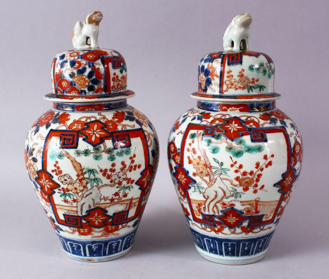 A PAIR OF MEIJI PERIOD IMARI VASES AND COVERS, with (1 of 10)