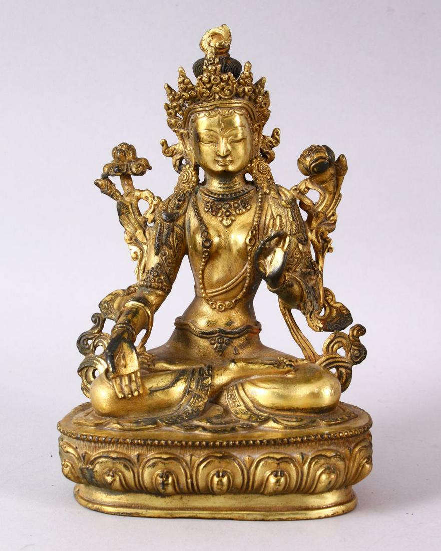 A THAI GILT BRONZE SEATED FEMALE DIETY, 20cm high. (1 of 7)