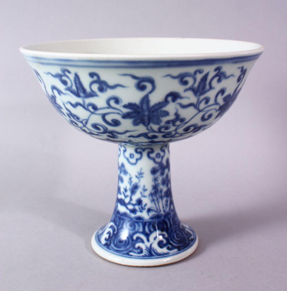 A CHINESE BLUE & WHITE PORCELAIN STEM BOWL - FOR THE: A CHINESE BLUE & WHITE PORCELAIN STEM BOWL - FOR THE ISLAMIC MARKET, decorated with formal scrolling lotus rosette, 16cm high x 18cm diameter