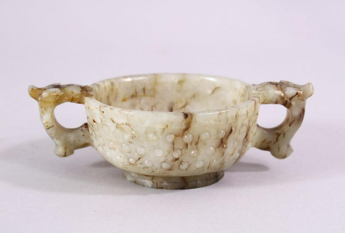 A CHINESE CARVED JADE ARCHAIC STYLE TWIN HANDLE CUP, (1 of 6)