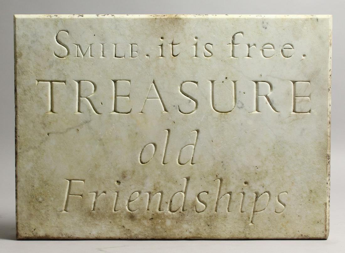 AN ITALIAN CARVED WHITE MARBLE PLAQUE, carved 'Smile It: AN ITALIAN CARVED WHITE MARBLE PLAQUE, carved 'Smile It Is Free, TREASURE Old Friendships'. 13ins wide x 19ins long x 2ins deep.