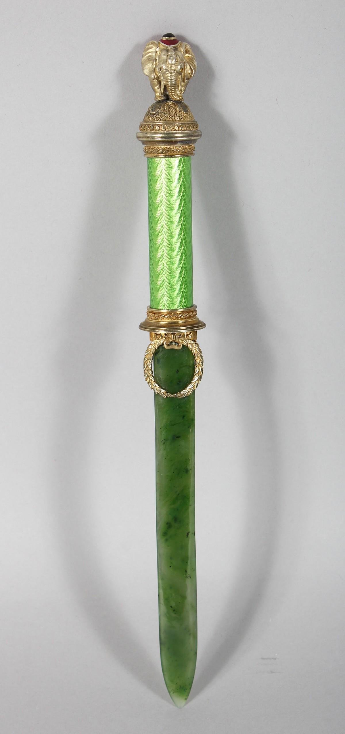 A SUPERB RUSSIAN SILVER GILT AND JADE PAGE TURNER with: A SUPERB RUSSIAN SILVER GILT AND JADE PAGE TURNER with elephant finial. 10ins long.