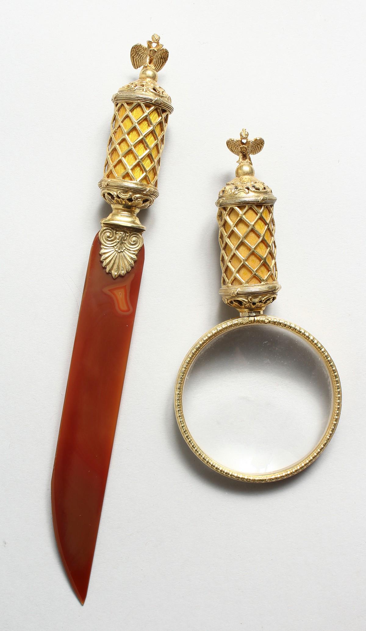 A SUPERB RUSSIAN SILVER GILT AND ENAMEL MAGNIFYING: A SUPERB RUSSIAN SILVER GILT AND ENAMEL MAGNIFYING GLASS AND PAGE TURNER with eagle finial (2). 5.25ins long.