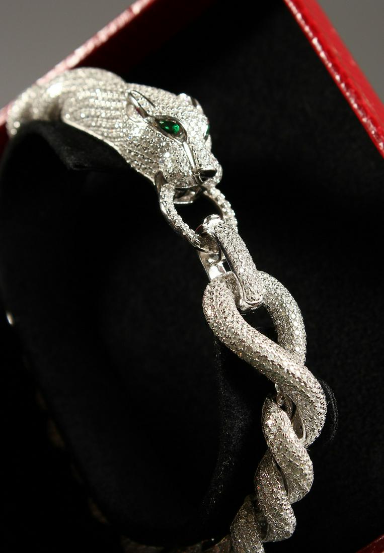 A CARTIER STYLE SILVER CABLE TWIST PANTHER BRACELET.: A CARTIER STYLE SILVER CABLE TWIST PANTHER BRACELET.