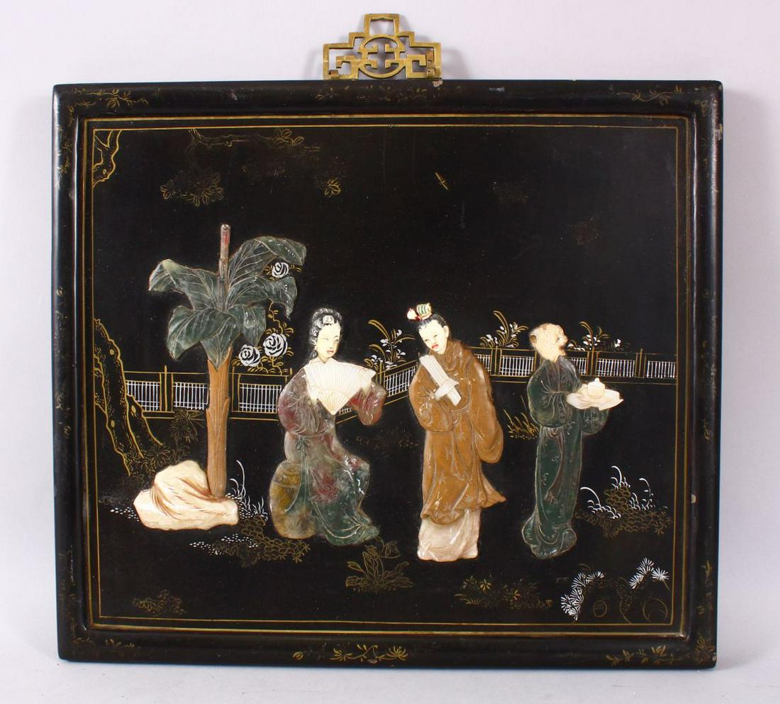 A CHINESE CARVED HARD STONE INLAID PANEL, depicting: A CHINESE CARVED HARD STONE INLAID PANEL, depicting figures in a garden setting upon a lacquer ground, 35.5cm x 40cm