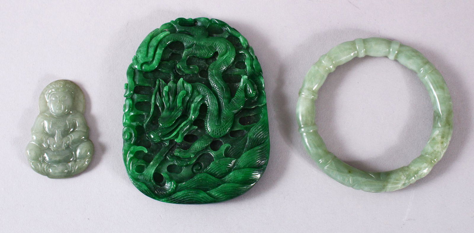 THREE CHINESE JADE / JADEITE ITEMS, one large pendant, (1 of 5)