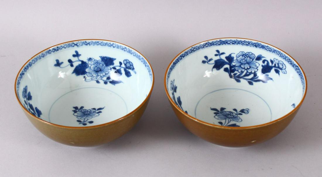 A PAIR OF CHINESE NANING CARGO BLUE & WHITE BOWLS, with: A PAIR OF CHINESE NANING CARGO BLUE & WHITE BOWLS, with a cafe au lait exterior glaze and floral blue underglaze interior decoration, 16.5cm (2)
