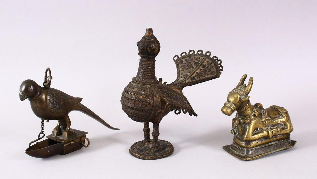 AN INDIAN BRASS NANDI BULL, together with a bird oil (1 of 6)
