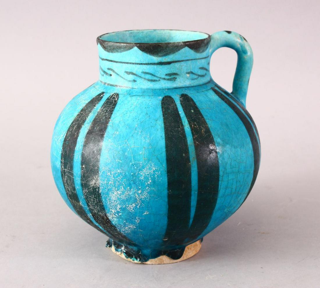 A GOOD EARLY ISLAMIC RAQQA POTTERY EWER, with a blue (1 of 5)