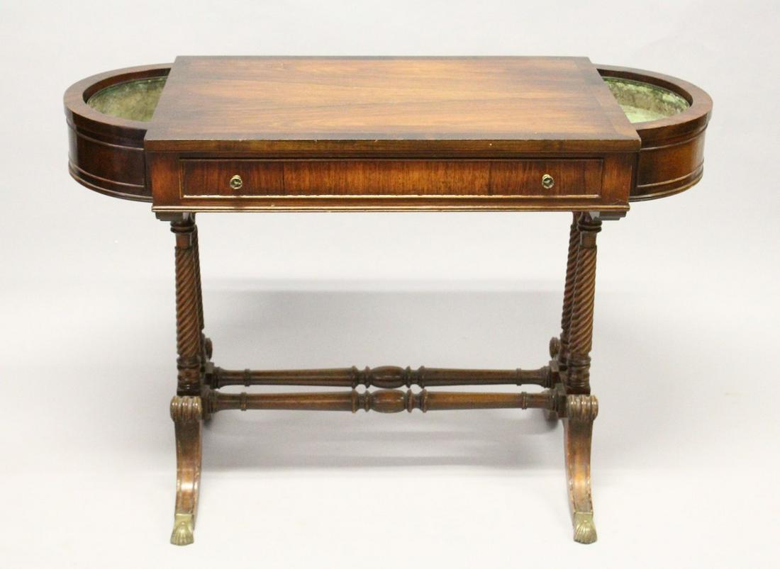 A REGENCY DESIGN MAHOGANY SIDE TABLE, with a single: A REGENCY DESIGN MAHOGANY SIDE TABLE, with a single drawer, the bowed ends with zinc liners, supported on wrythen fluted columns with curving legs and brass casters. 3 ft 8 ins long x 1 ft 8 ins diame