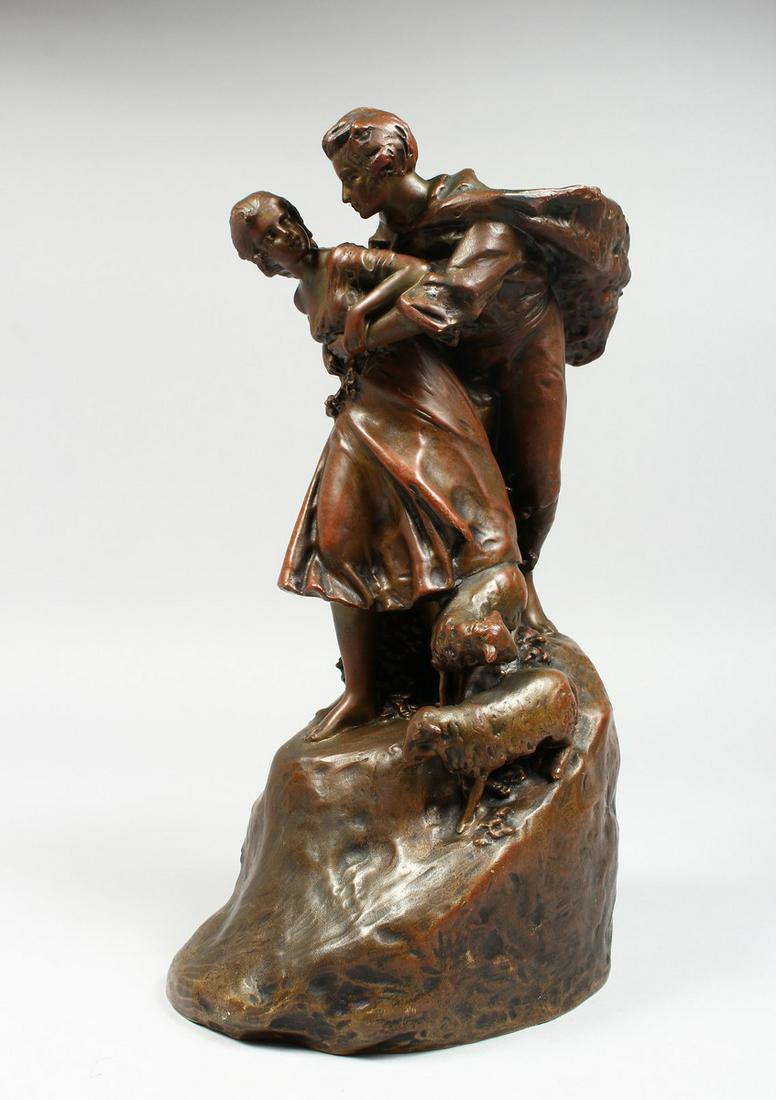 A GOOD BRONZE GROUP, a gallant and a young girl, two: A GOOD BRONZE GROUP, a gallant and a young girl, two lambs at her side, signed, stamped AR 13 - 9 (Arthur Rubenstein).