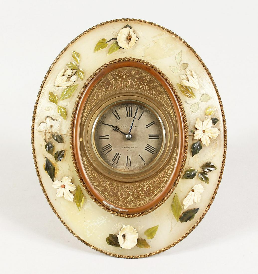 AN ONYX OVAL STRUTT TYPE CLOCK by BIRCH & CAYDEN,: AN ONYX OVAL STRUTT TYPE CLOCK by BIRCH & CAYDEN, Fenchurch Street. 8.5 ins x 6.5 ins