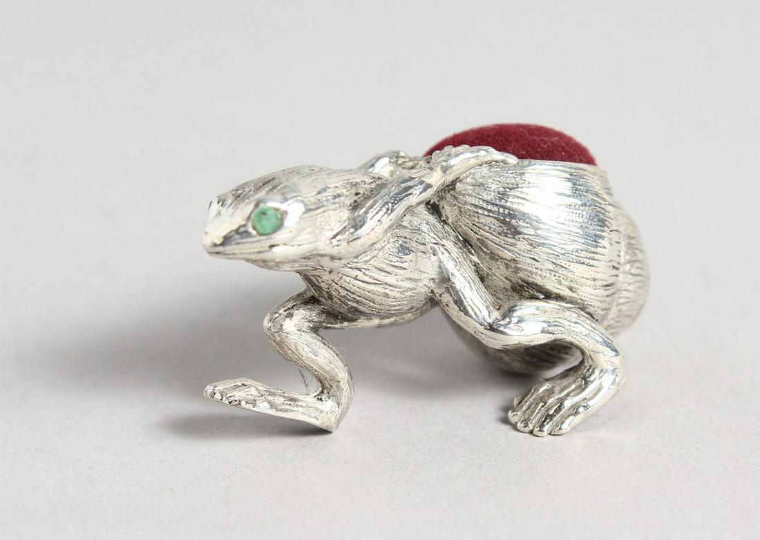 A SILVER PLATE FROG PIN CUSHION: A SILVER PLATE FROG PIN CUSHION