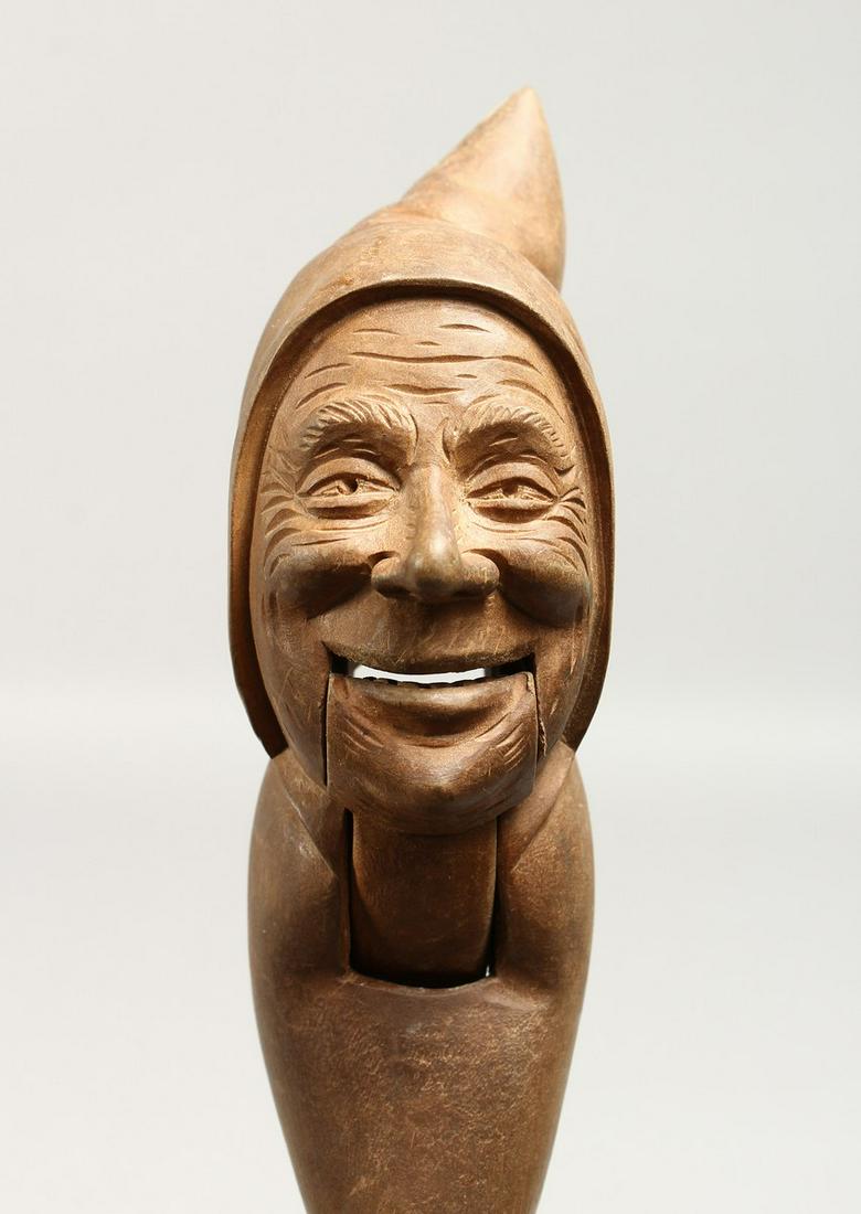 A CARVED WOOD DWARF NUTCRACKER.: A CARVED WOOD DWARF NUTCRACKER.