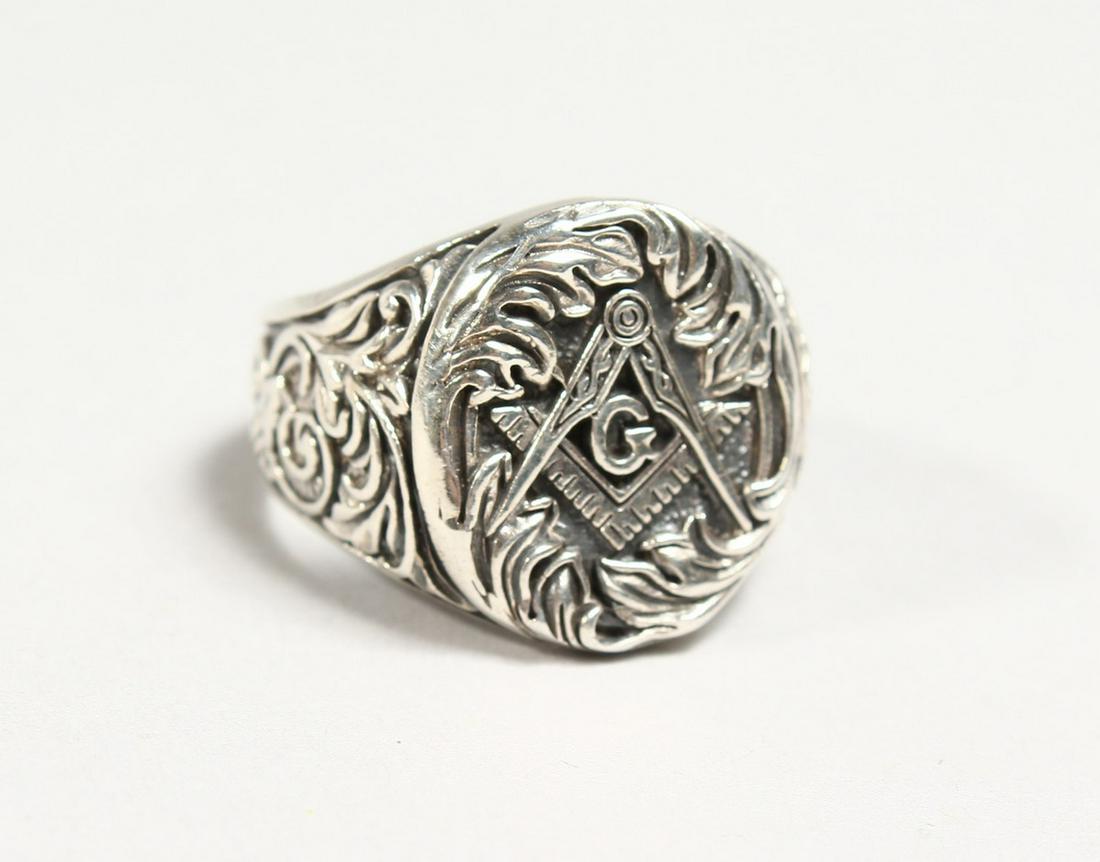 A SILVER MASONIC RING: A SILVER MASONIC RING