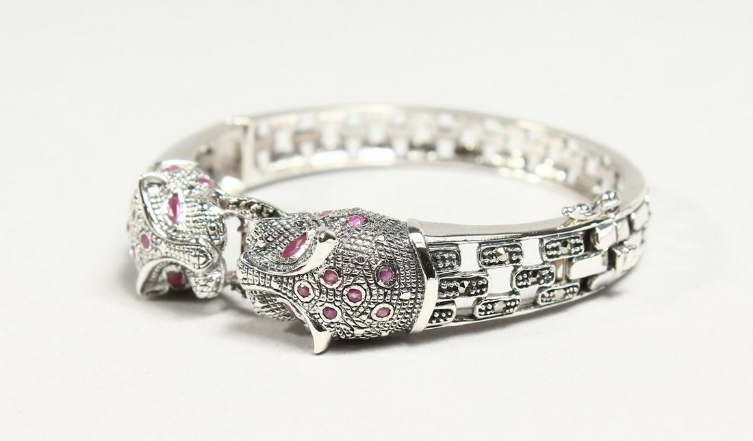 A SILVER AND RUBY SET PANTHER HEAD BRACELET: A SILVER AND RUBY SET PANTHER HEAD BRACELET