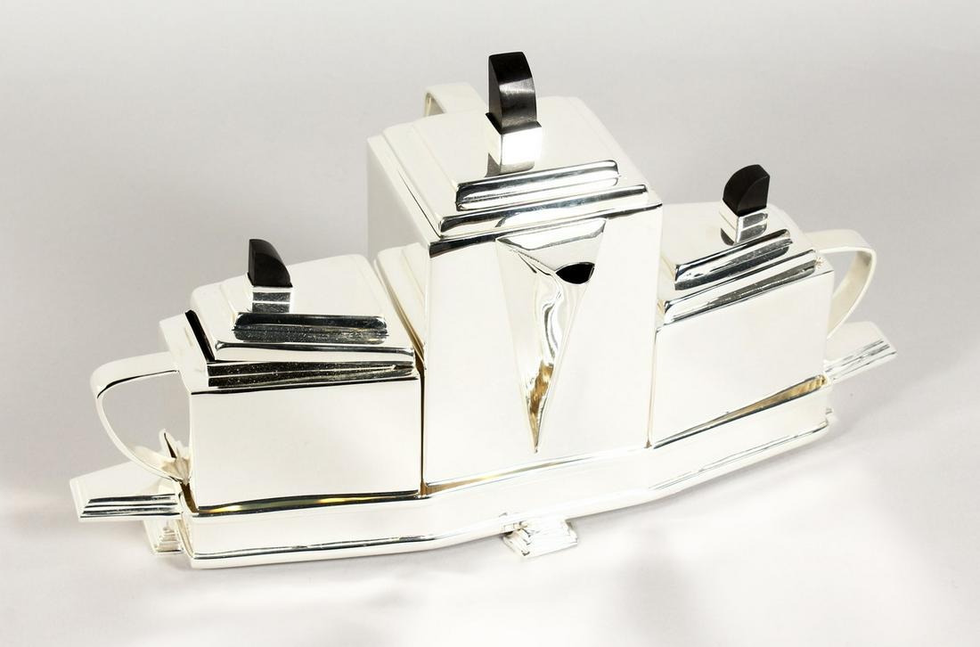 A CHRISTOPHER DRESSER STYLE PLATED TEA SET ON A STAND: A CHRISTOPHER DRESSER STYLE PLATED TEA SET ON A STAND