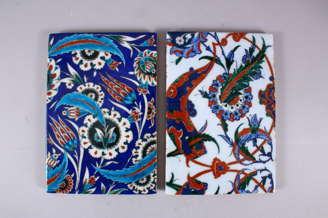 TWO GOOD IZNIK STYLE POTTERY TILE SECTIONS, one with a (1 of 2)