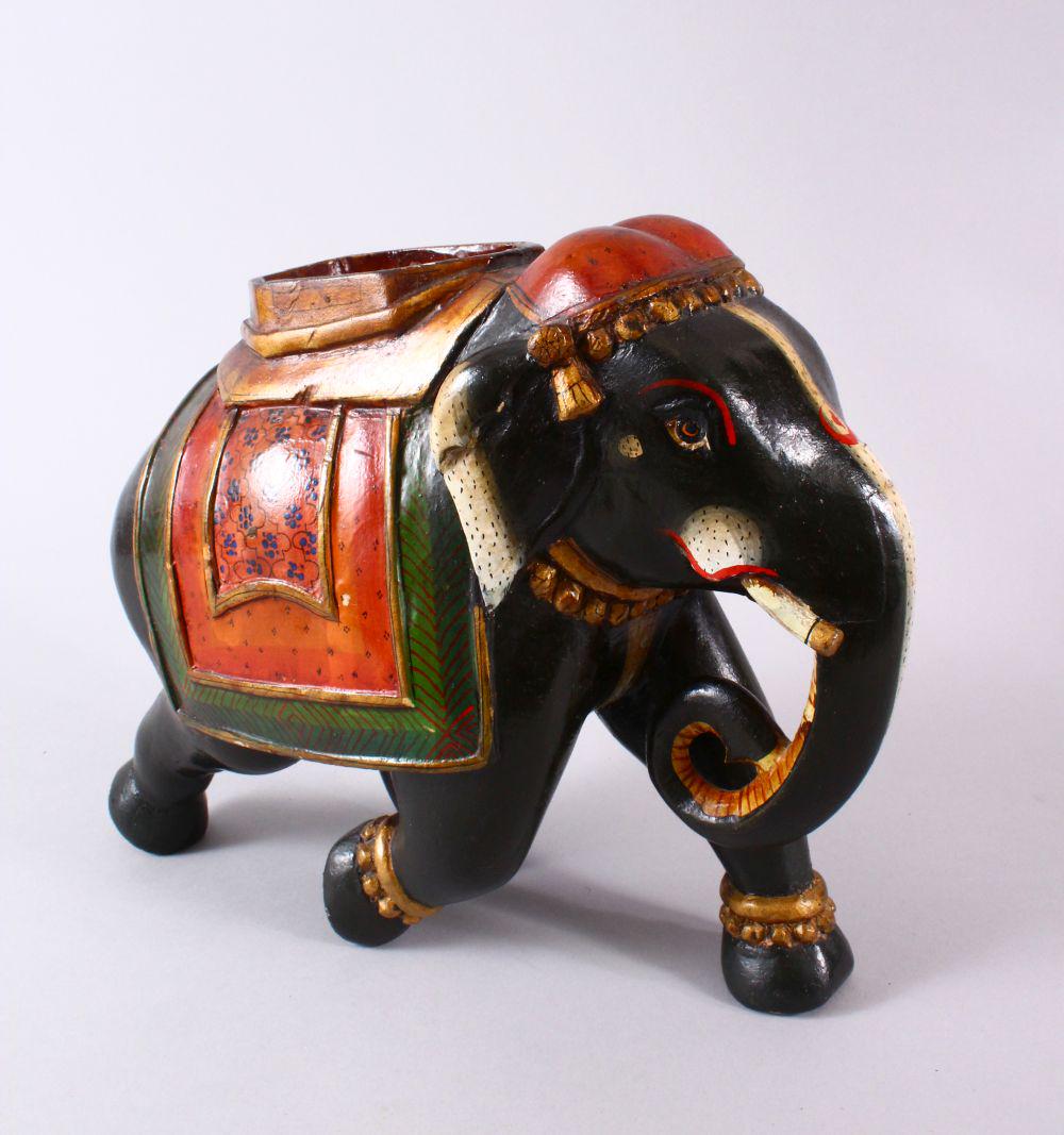 AN INDIAN LACQUER MODEL ELEPHANT, with decorated wears,: AN INDIAN LACQUER MODEL ELEPHANT, with decorated wears, 30cm wide