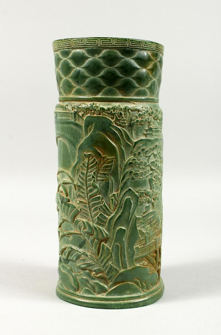 A LARGE CHINESE CARVED BAMBOO JADE VASE, carved with: A LARGE CHINESE CARVED BAMBOO JADE VASE, carved with foliage and fences.