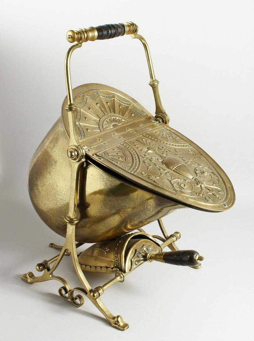 A VERY GOOD VICTORIAN BRASS COAL PURDONIUM on a folding: A VERY GOOD VICTORIAN BRASS COAL PURDONIUM on a folding stand with shovel.
