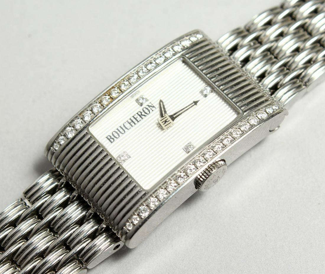 A GOOD DIAMOND SET BOUCHERON WATCH No. 090-3067 in: A GOOD DIAMOND SET BOUCHERON WATCH No. 090-3067 in original pouch