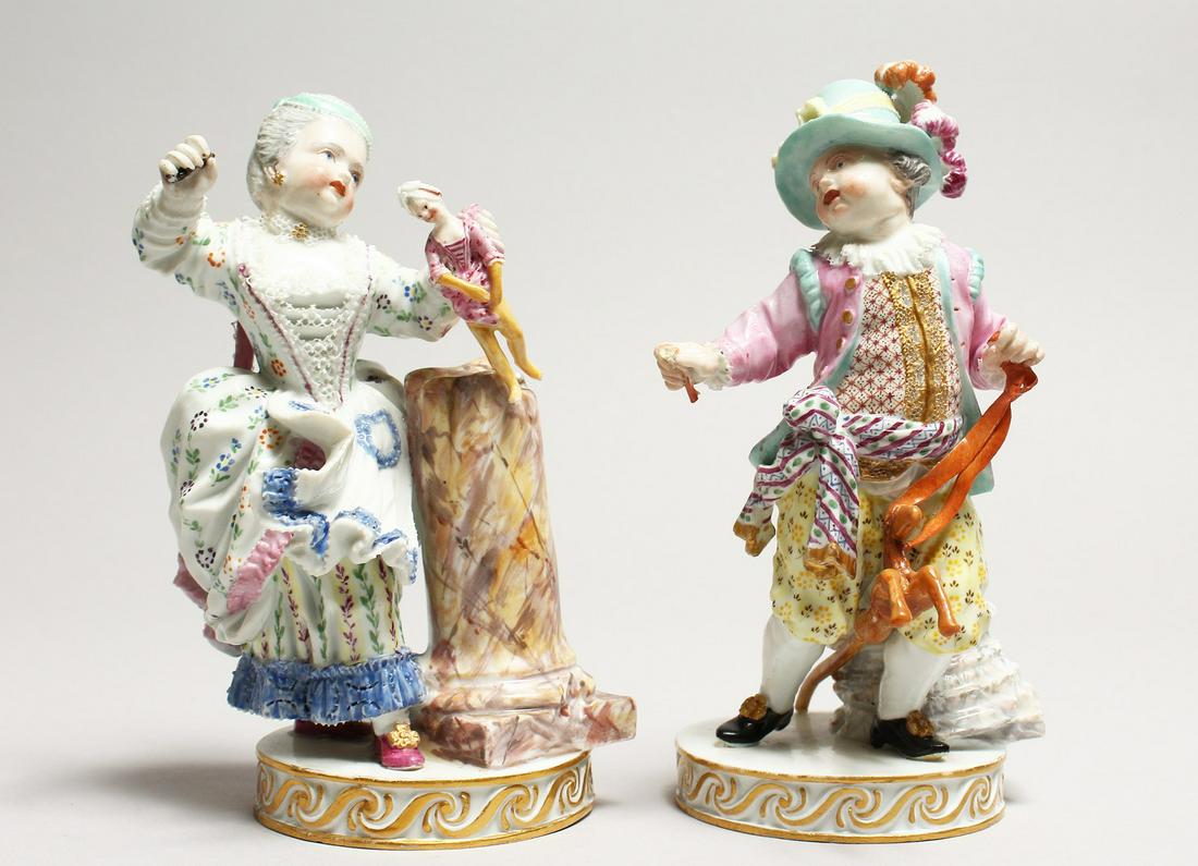 A GOOD PAIR OF MEISSEN PORCELAIN FIGURES a boy holding: A GOOD PAIR OF MEISSEN PORCELAIN FIGURES a boy holding a hobby horse and a young girl with a doll. Crossed swords mark in blue, incised No. E.95. 6ins high.