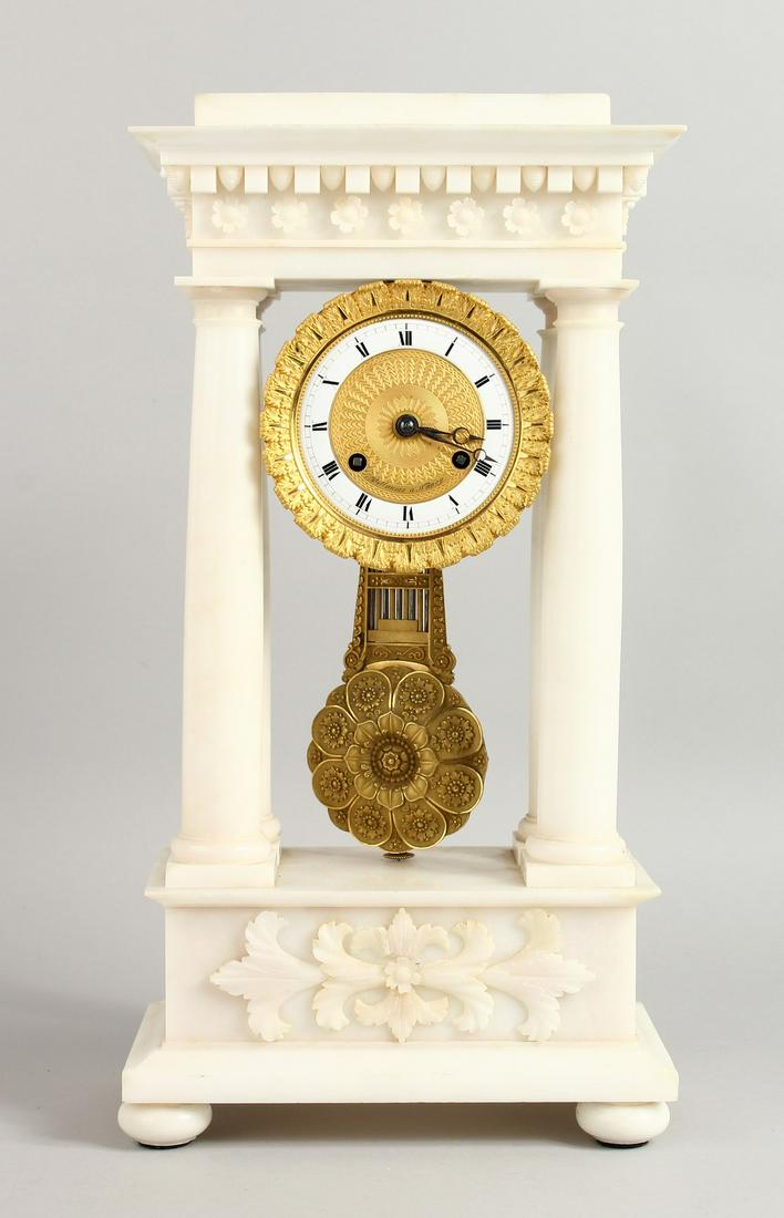 A SUPERB FRENCH EMPIRE WHITE ALABASTER PILLAR CLOCK by: A SUPERB FRENCH EMPIRE WHITE ALABASTER PILLAR CLOCK by VILLAUME A NANCY, CIRCA. 1840, with gilt dial and Roman numerals, with large pendulum. No. 8922. 17.5ins high.