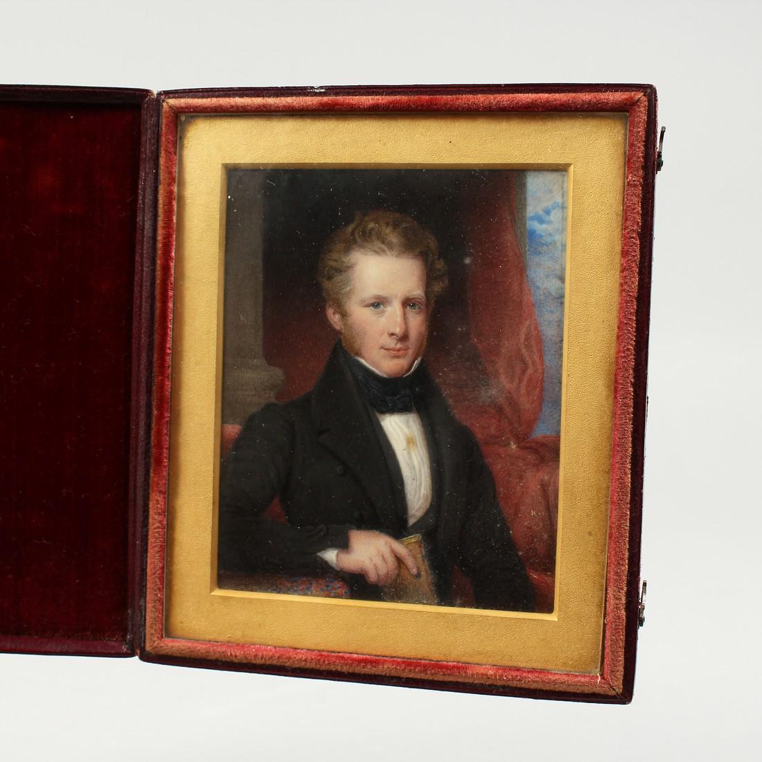 AN EARLY VICTORIAN PORTRAIT MINIATURE OF A YOUNG MAN,: AN EARLY VICTORIAN PORTRAIT MINIATURE OF A YOUNG MAN, in a folding leather case. 4ins x 3ins.