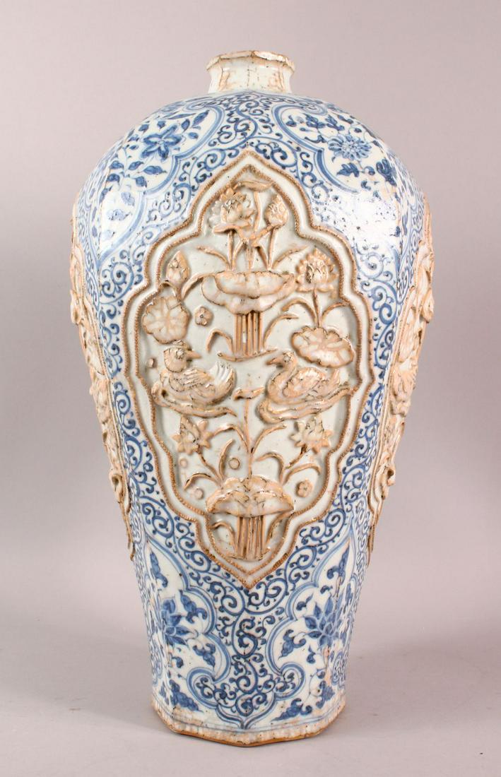 A CHINESE BLUE & WHITE CARVED PORCELAIN MEIPING VASE,: A CHINESE BLUE & WHITE CARVED PORCELAIN MEIPING VASE, with moulded panels of lotus decoration, blue lotus body decor, 46cm high.