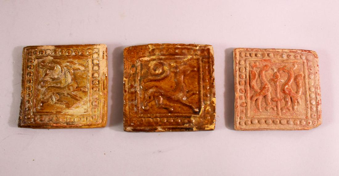 THREE 16TH CENTURY POTTERY TILE SECTIONS, each with (1 of 2)