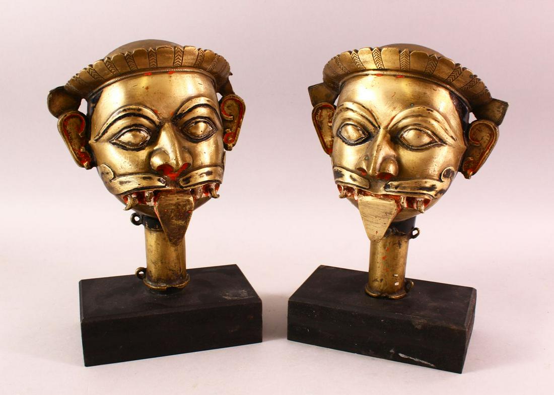A PAIR OF 19TH / 19TH CENTURY SOUTH INDIAN BRASS MASKS (1 of 5)