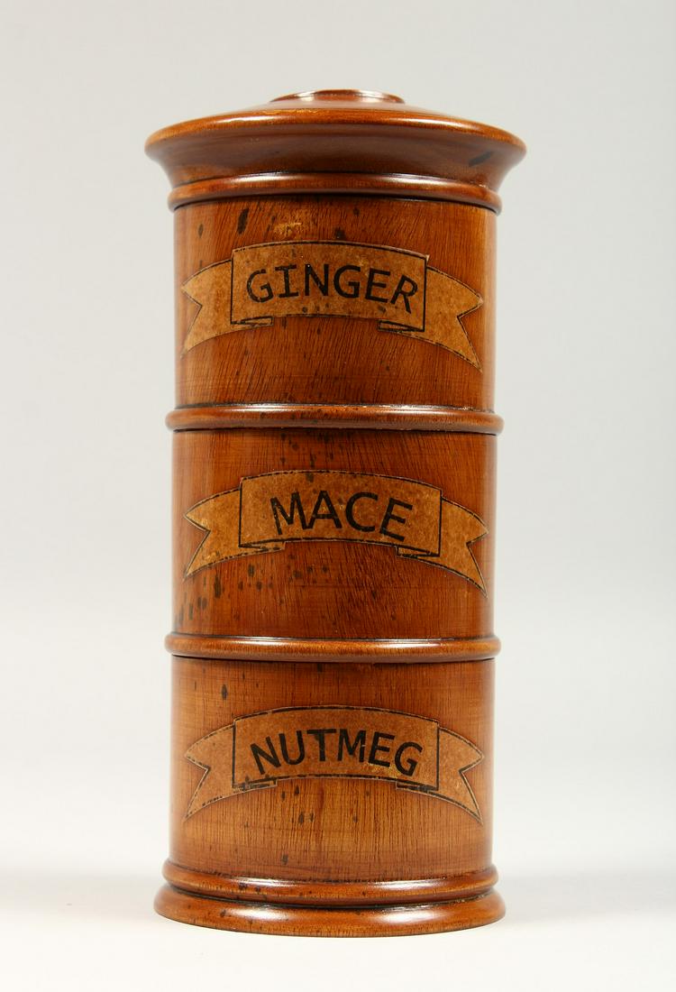 A THREE TIER SPICE HOLDER, GINGER, MACE AND NUTMEG.: A THREE TIER SPICE HOLDER, GINGER, MACE AND NUTMEG. 8ins high