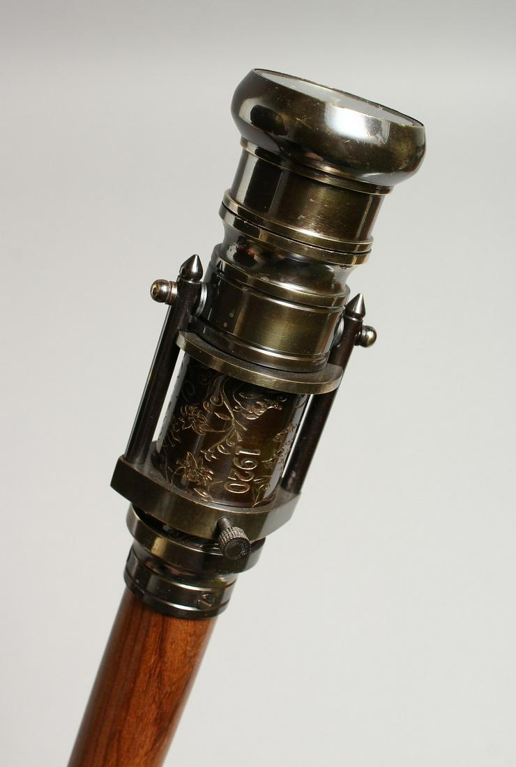 A WALKING STICK with a telescope and compass 36ins: A WALKING STICK with a telescope and compass 36ins long