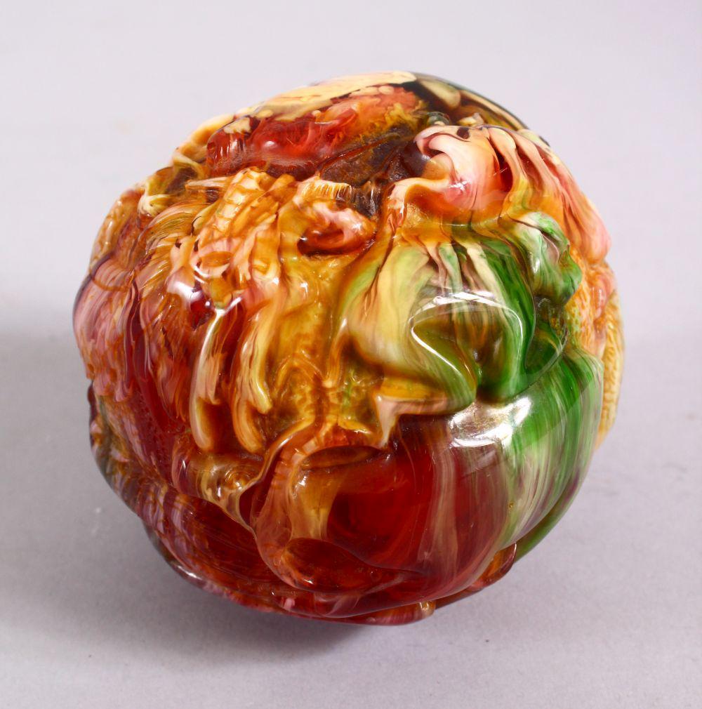 A CHINESE CARVED BAKELITE OR CHERRY AMBER ZODIAC BALL, (1 of 8)