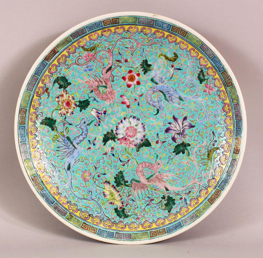 A CHINESE 20TH CENTURY POSS REPUBLIC FAMILLE ROSE: A CHINESE 20TH CENTURY POSS REPUBLIC FAMILLE ROSE PORCELAIN DISH - decorated with a turquoise ground and phoenix birds amongst scrolling foliage - 33cm diameter
